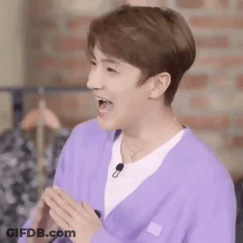 Person In Purple Cardigan White Shirt Mouth Open GIF