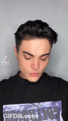 Person In Rainbow Sunglasses Taking Selfie With TikTok Logo GIF