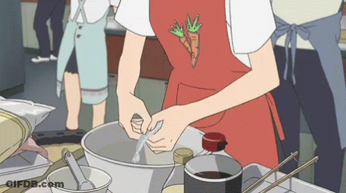Person In Red Apron With Carrot Preparing Food GIF