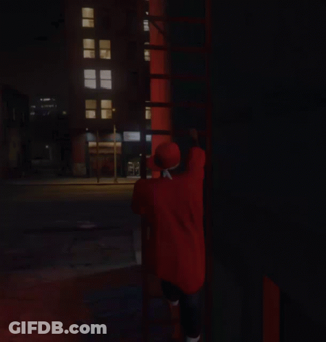 Person In Red Graffiti Shirt Doing Handstand GIF