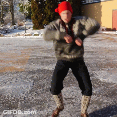 Person In Red Hat Dancing In Snow GIF