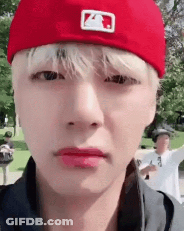 Person In Red Hat Making Face GIF