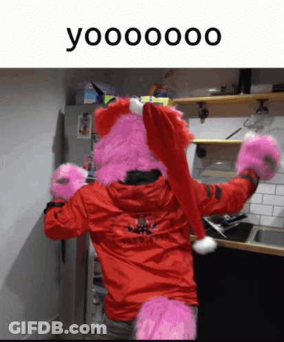 Person In Red Jacket And Santa Hat Saying Yooooooo GIF