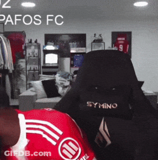 Person In Red Pafos FC Jersey In Gaming Chair GIF