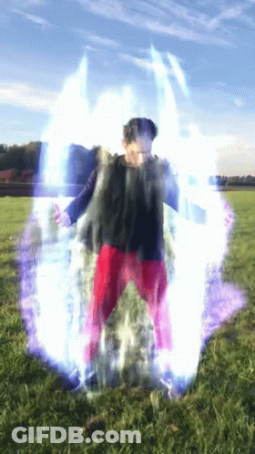 Person In Red Pants Standing In Field With Blue Light GIF