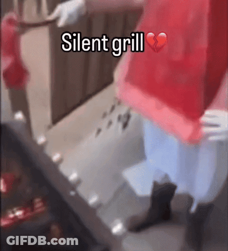 Person In Red Shirt At Grill With Broken Heart GIF