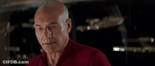 Person In Red Shirt Holding Gun By Fountain GIF