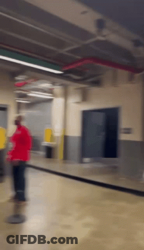 Person In Red Shirt Walking GIF