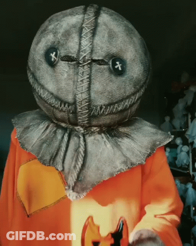 Person In Scarecrow Costume Holding Pumpkin GIF