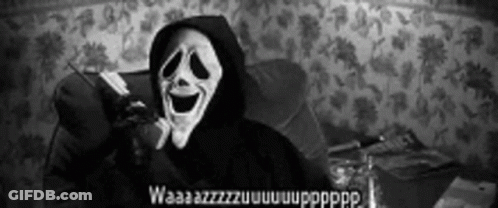 Person In Scary Mask Sitting In Chair GIF