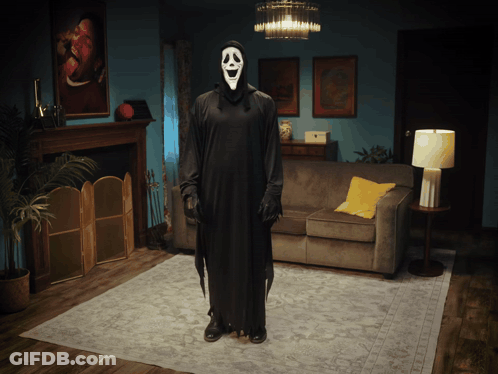 Person In Scream Costume In Living Room GIF