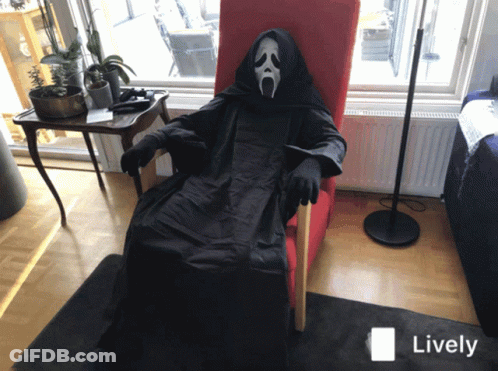 Person In Scream Costume Sitting In Chair GIF