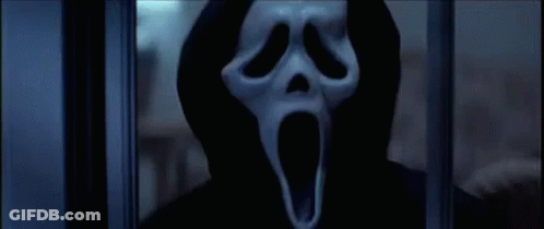 Person In Scream Mask Behind Window GIF
