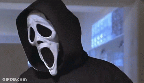 Person In Scream Mask Behind Window GIF