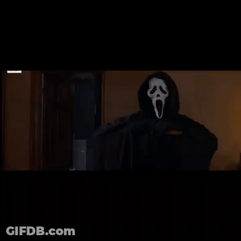 Person In Scream Mask Holding Knife GIF