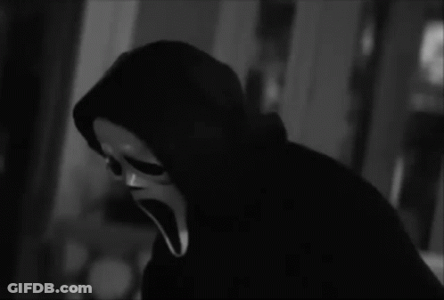 Person In Scream Mask Holding Knife GIF