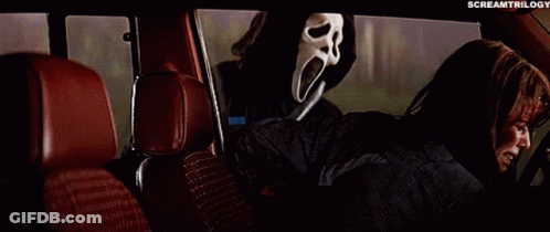 Person In Scream Mask In Car Back Seat GIF