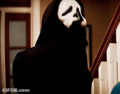 Person In Scream Mask On Stairs GIF