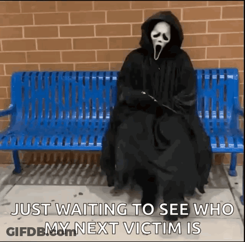 Person In Scream Mask Sitting On Blue Bench GIF
