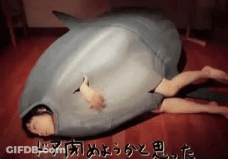 Person In Shark Costume Lying On Floor GIF