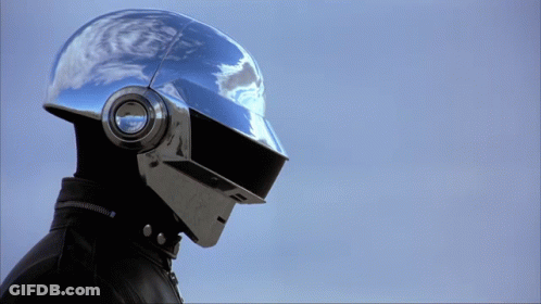 Person In Silver Helmet With Headphones GIF
