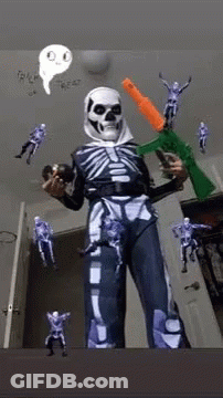 Person In Skeleton Costume Holding Gun And Toy GIF