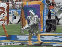 Person In SpongeBob Costume Walking On Field GIF