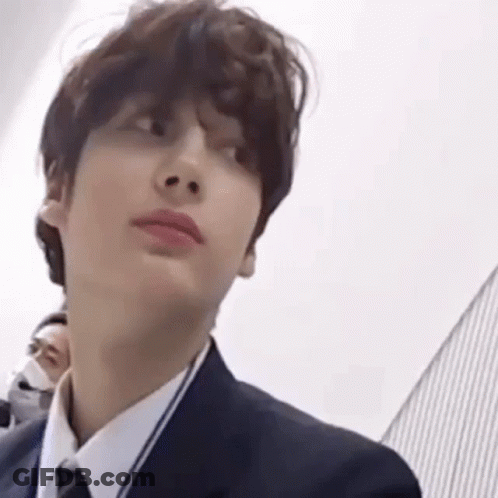 Person In Suit And Tie Looking At Camera GIF