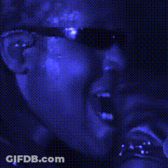 Person In Sunglasses In Dark Room GIF