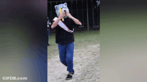 Person In Teddy Bear Mask Holding Banana GIF