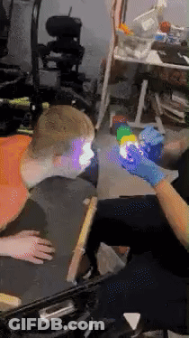 Person In Wheelchair Getting Arm Tattoo GIF