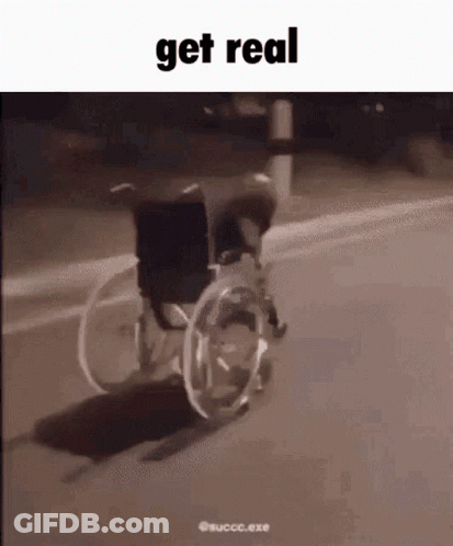 Person In Wheelchair Riding Down Street At Night GIF