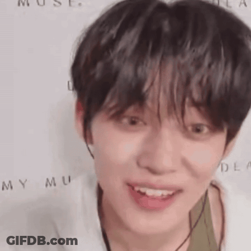 Person In White And Green Shirt Close Up GIF