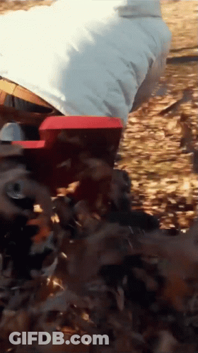 Person In White Jacket Standing In Woods GIF