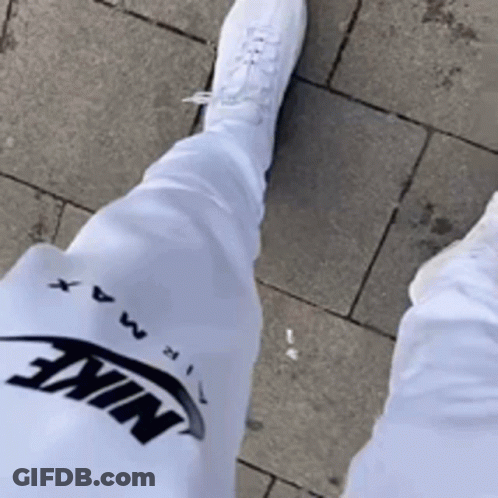 Person In White Nike Pants And White Shoes GIF