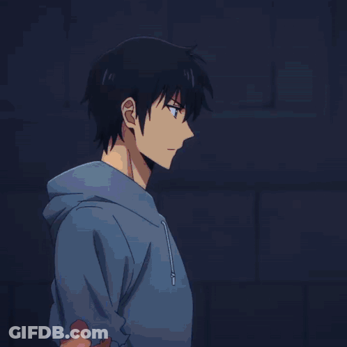 Person In White Shirt Standing In Dark Room GIF
