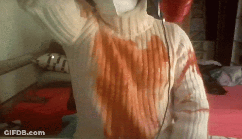 Person In White Sweater With Red Heart GIF