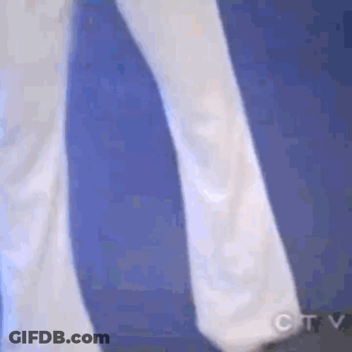 Person In White Walking On Blue Surface GIF