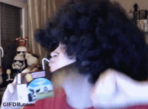 Person In Wig Drinking Milk Through Straw GIF