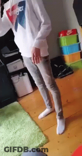 Person In Wrangler Sweatshirt And Jeans Standing In Room GIF