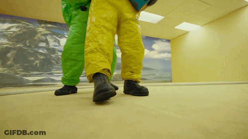 Person In Yellow And Green Pants Walking GIF