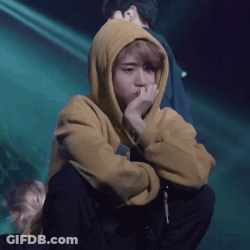Person In Yellow Hoodie Covering Face GIF