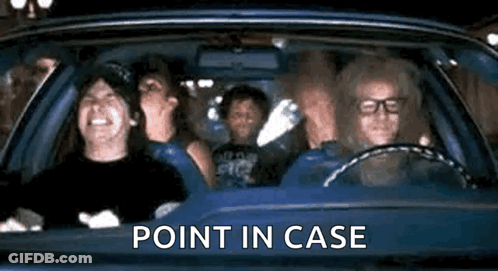 Person In Yellow Shirt Standing In Front Of Curtain GIF