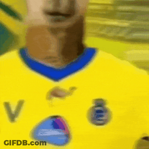 Person In Yellow Shirt With Letter V GIF