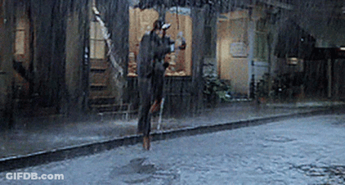 Person Jumping In Rain GIF