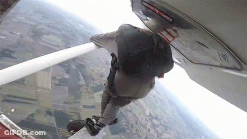 Person Jumping Out Of Plane With Emergency Exit Sign GIF
