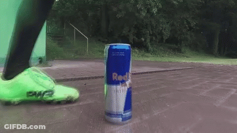 Person Kicking Red Bull Can On Sidewalk GIF
