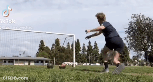 Person Kicking Soccer Ball In Front Of Goal With TikTok GIF