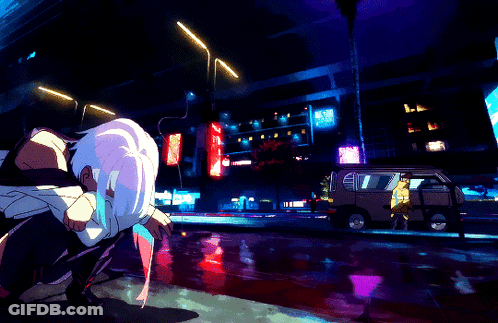 Person Kneeling In Front Of L.A. Building GIF