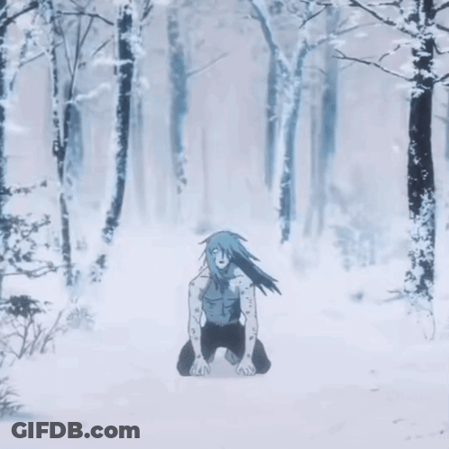 Person Kneeling In Snow In Forest GIF